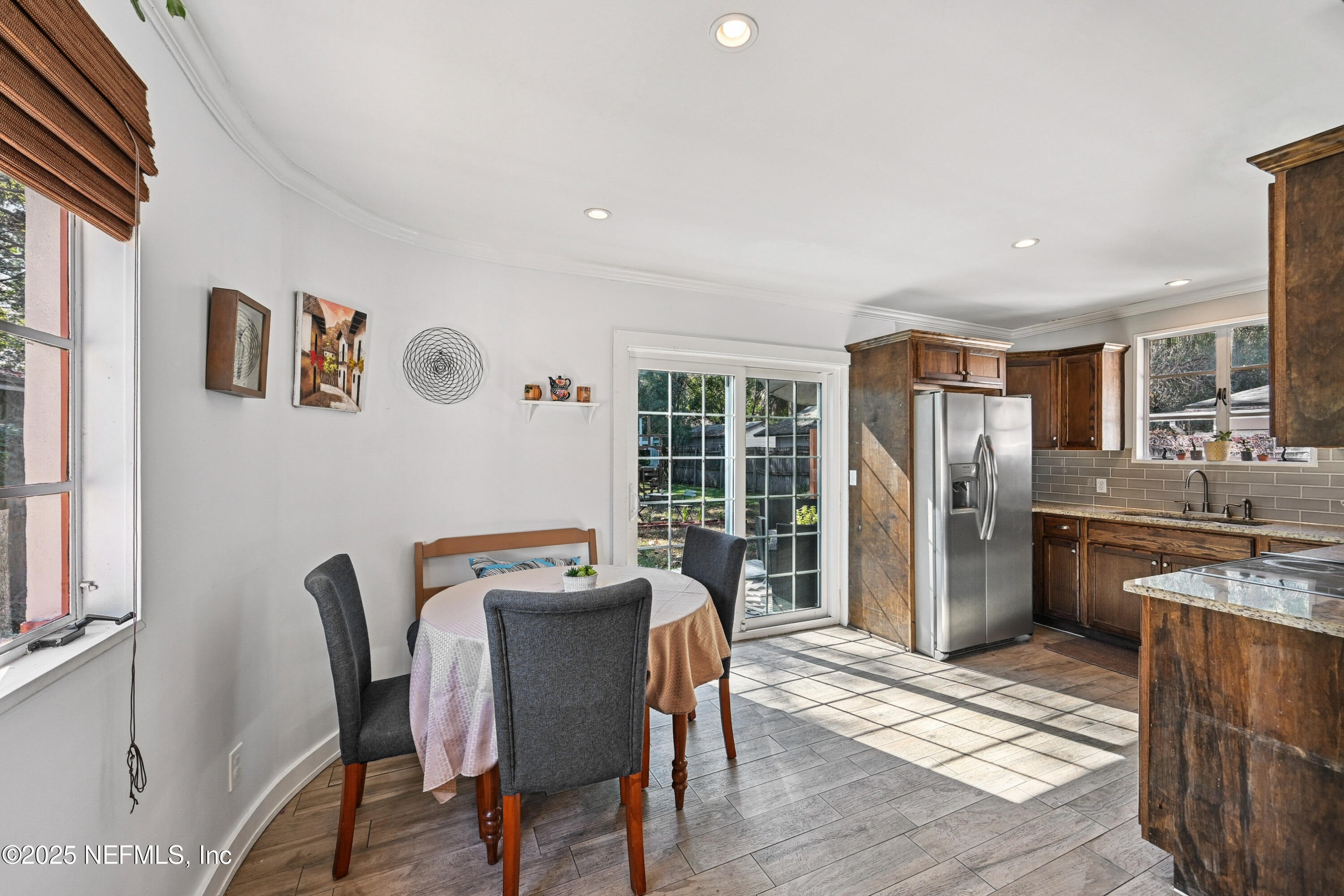 1316 Rensselaer Avenue Jacksonville, FL 32205 - Photo 14 of 46 a dining room with furniture and large window