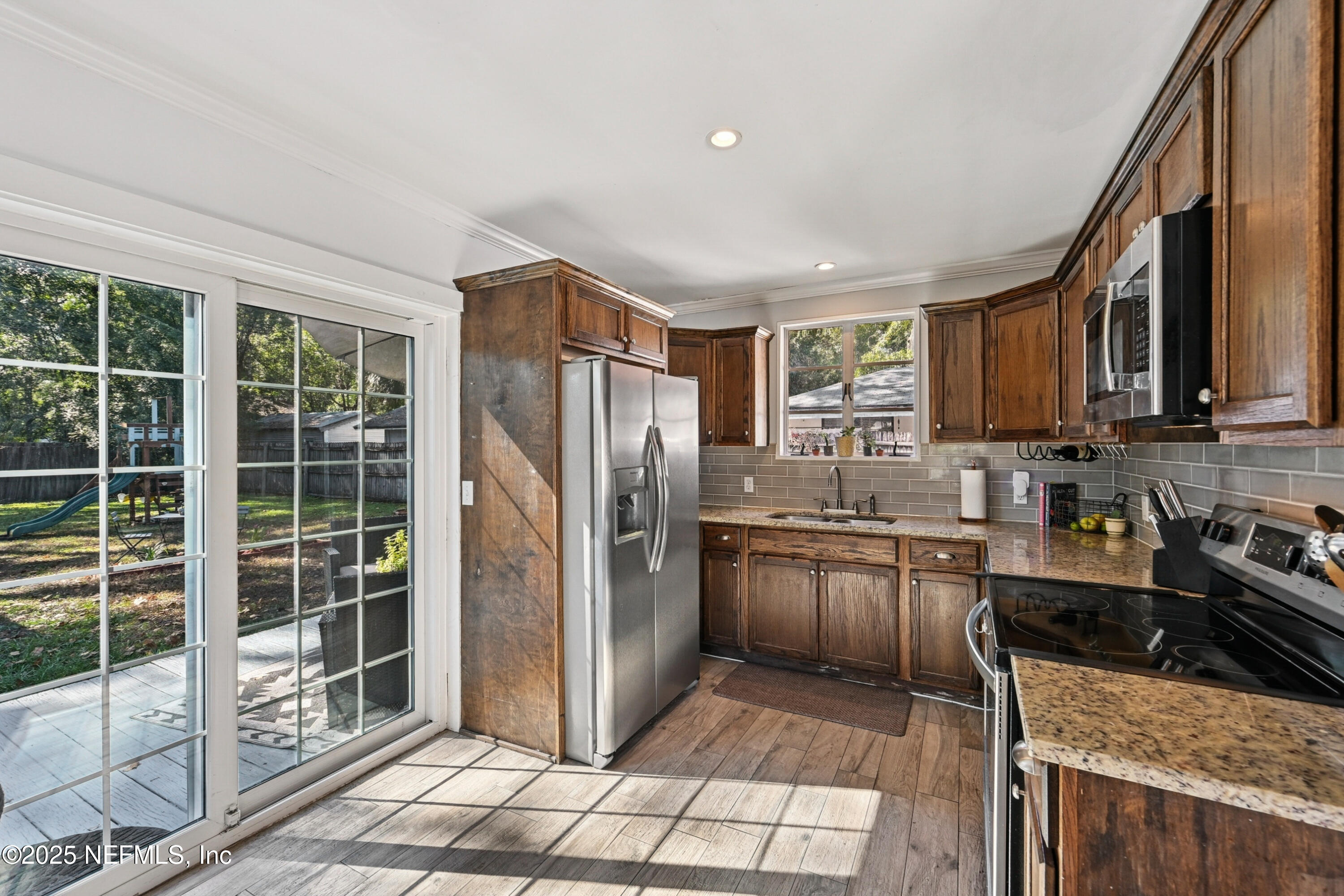 1316 Rensselaer Avenue Jacksonville, FL 32205 - Photo 16 of 46 a kitchen with stainless steel appliances granite countertop a refrigerator stove and sink