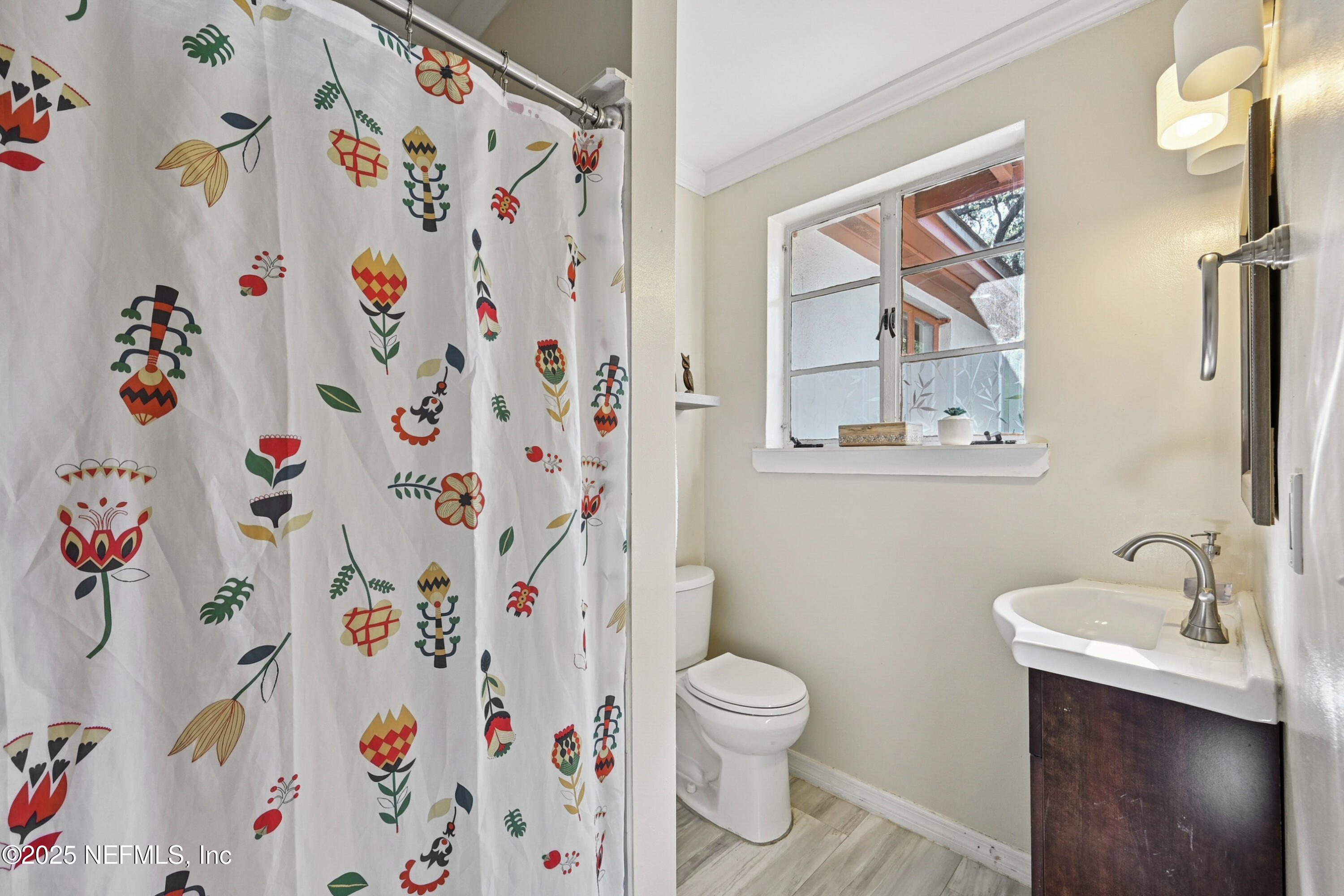 1316 Rensselaer Avenue Jacksonville, FL 32205 - Photo 26 of 46 a white toilet sitting next to a bathroom sink