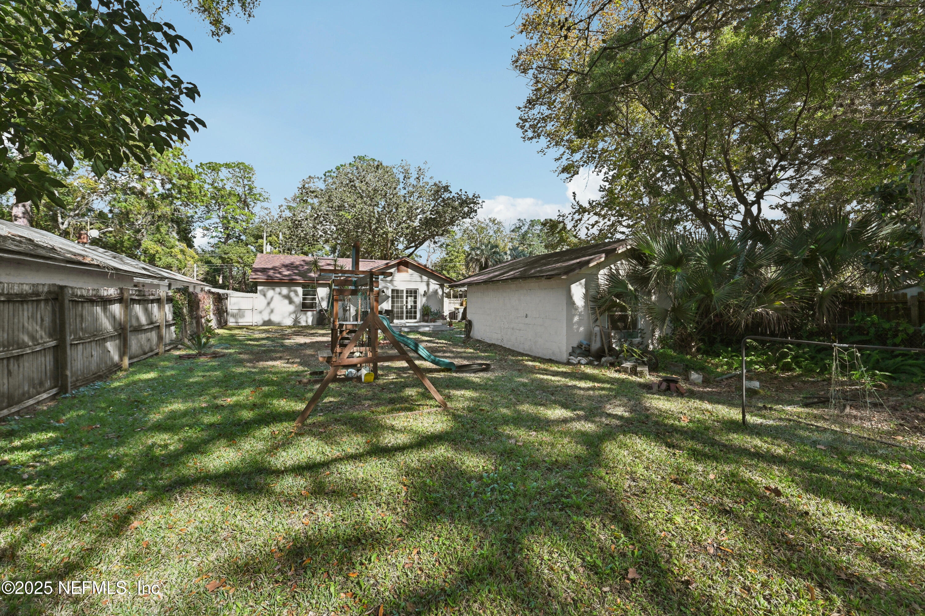 1316 Rensselaer Avenue Jacksonville, FL 32205 - Photo 41 of 46 a backyard of a house with table and chairs