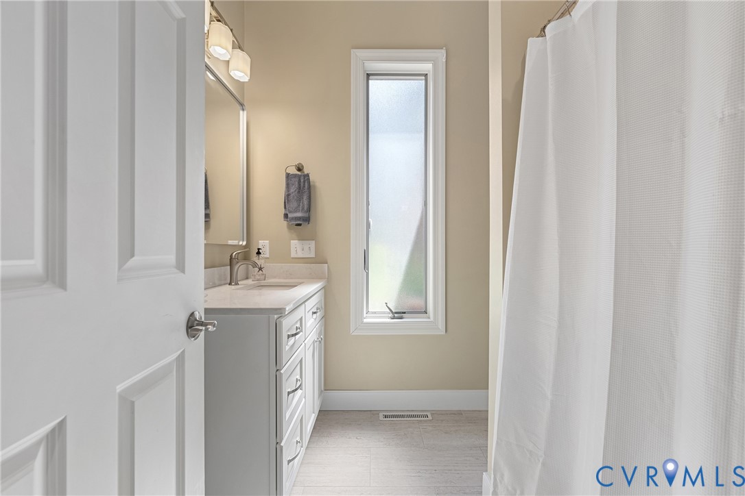 447 Tranquility Road Reedville, VA 22539 - Photo 38 of 82 White paneled door, single vanity with light-color