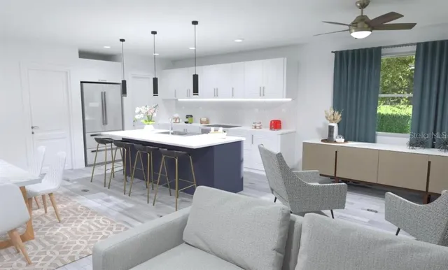 a living room with kitchen island furniture and a wooden floor