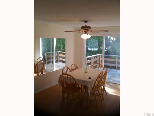 2532 Boothbay Court Raleigh, NC 27613 - Photo 6 of 12 The dining room overlooks the deck and wooded yard