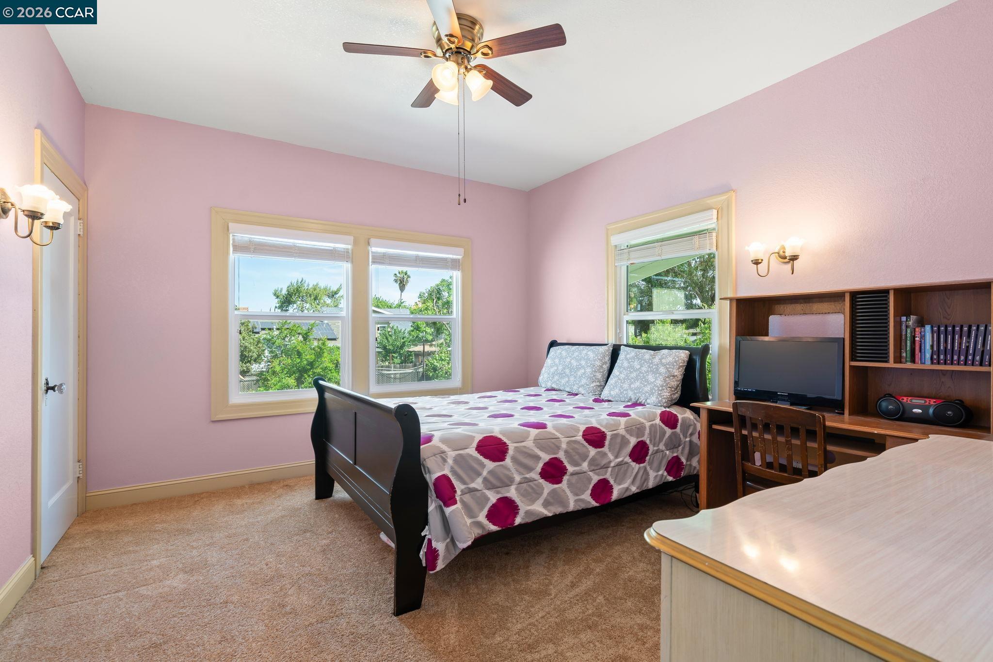 272 West 10th Street Pittsburg, CA 94565 - Photo 14 of 29 a bedroom with two beds and a window