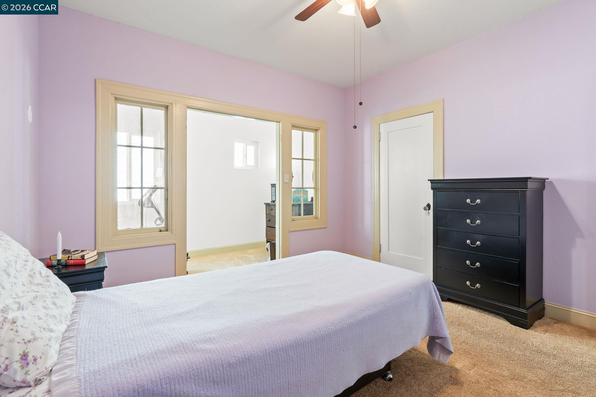 272 West 10th Street Pittsburg, CA 94565 - Photo 21 of 29 a bedroom with a bed and a window