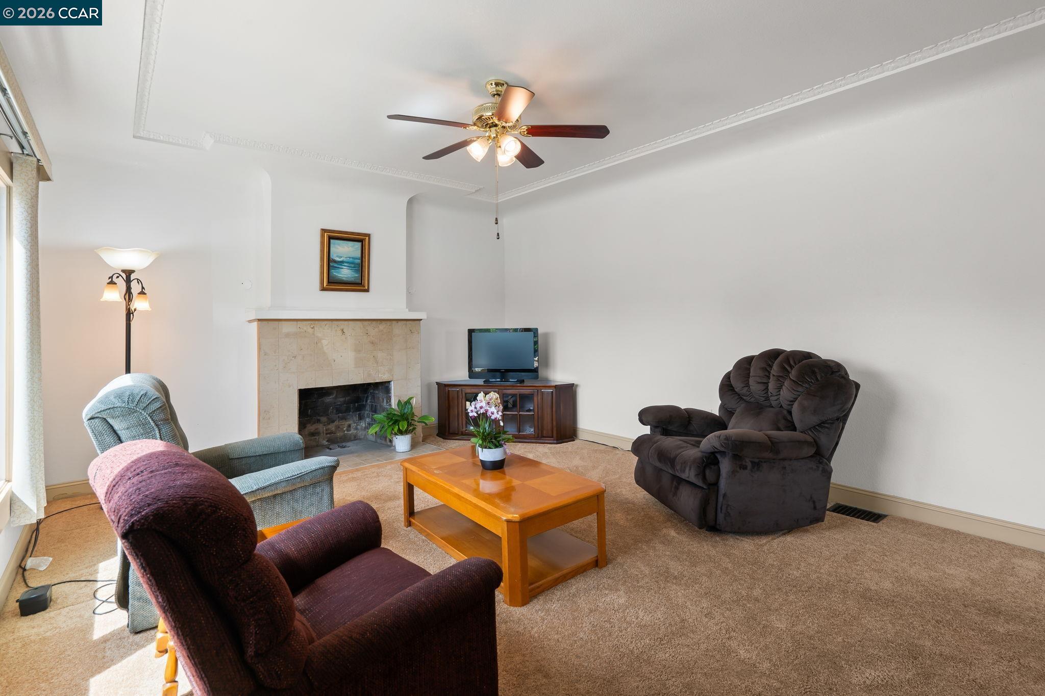 272 West 10th Street Pittsburg, CA 94565 - Photo 6 of 29 a living room with furniture fireplace and a window