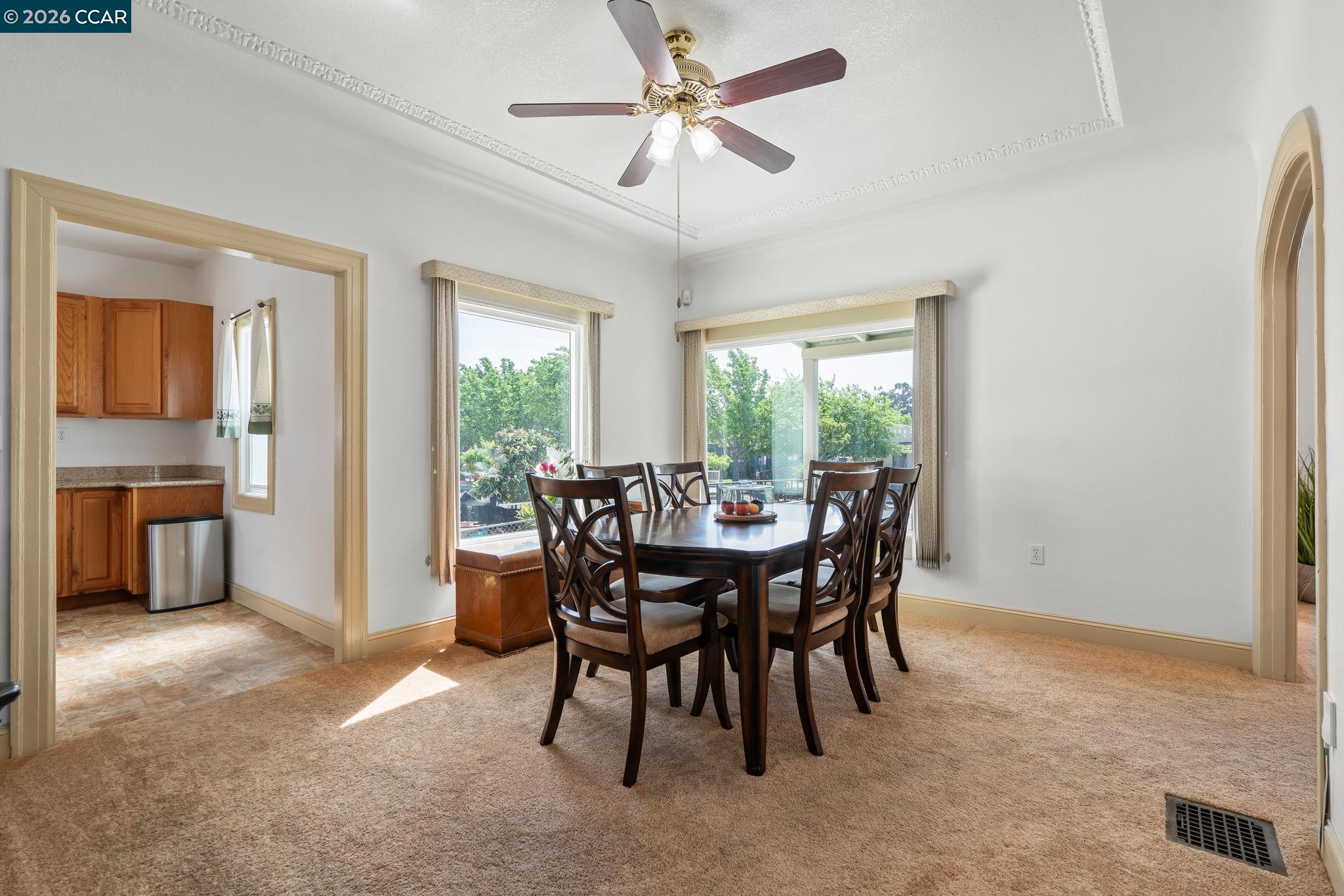 272 West 10th Street Pittsburg, CA 94565 - Photo 8 of 29 a dining room with furniture and window