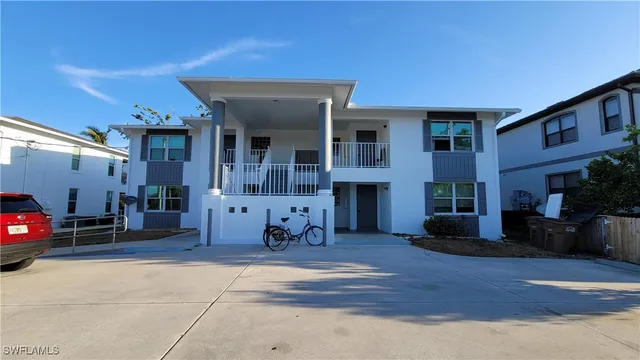 a view of a car park in front of house