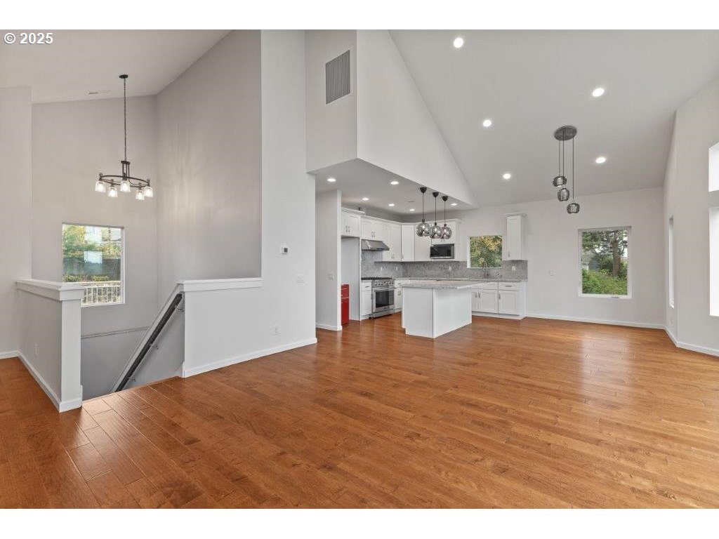 2495 Chester Street North Bend, OR 97459 - Photo 12 of 48 a view of a kitchen with kitchen island wooden floors wooden floor and appliances