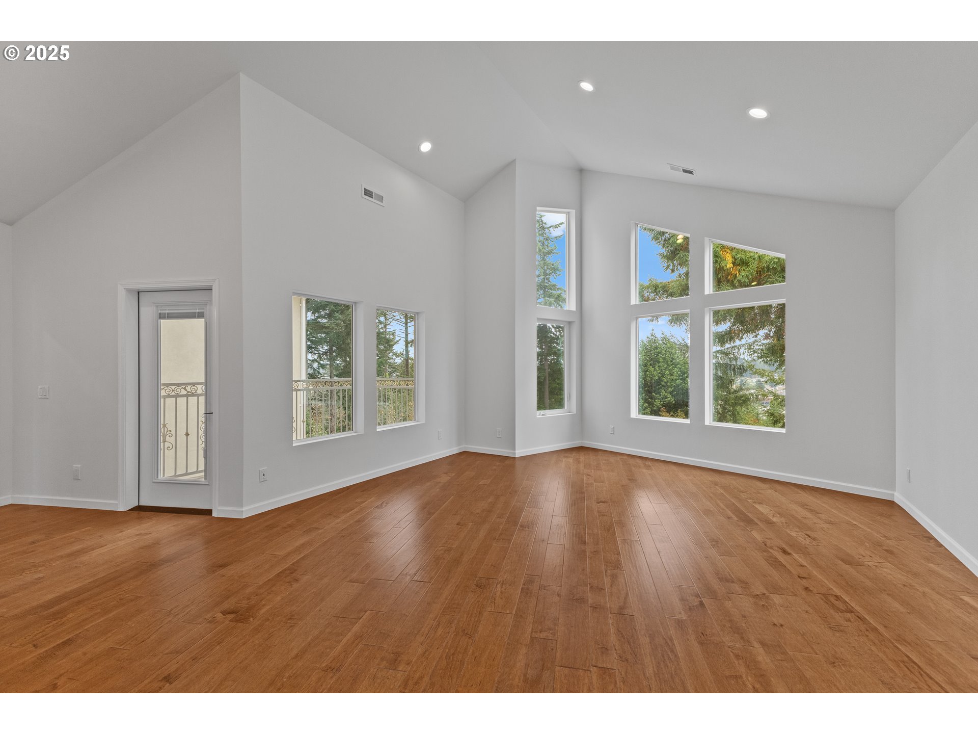 2495 Chester Street North Bend, OR 97459 - Photo 20 of 48 a view of an empty room with wooden floor and a window