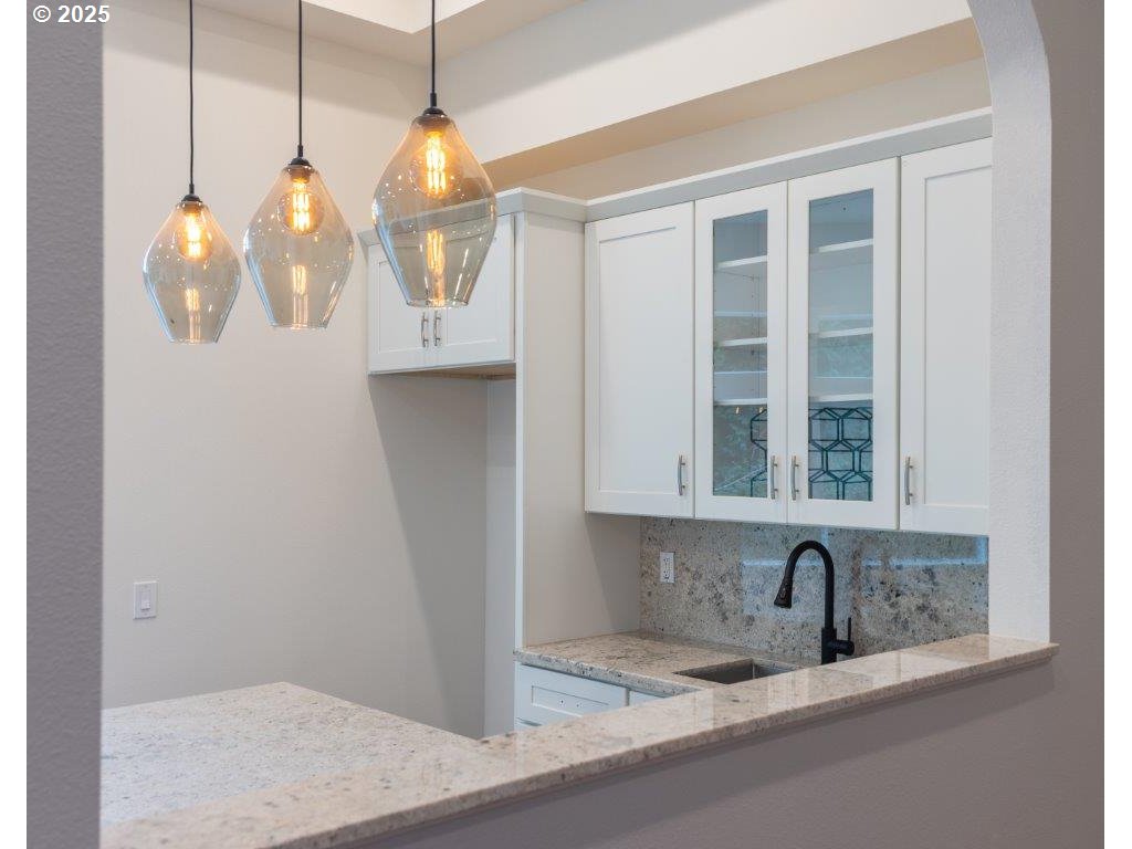 2495 Chester Street North Bend, OR 97459 - Photo 34 of 48 a kitchen with a sink and chandelier