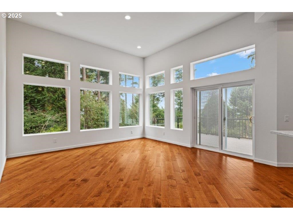 2495 Chester Street North Bend, OR 97459 - Photo 37 of 48 a view of an empty room with wooden floor and windows