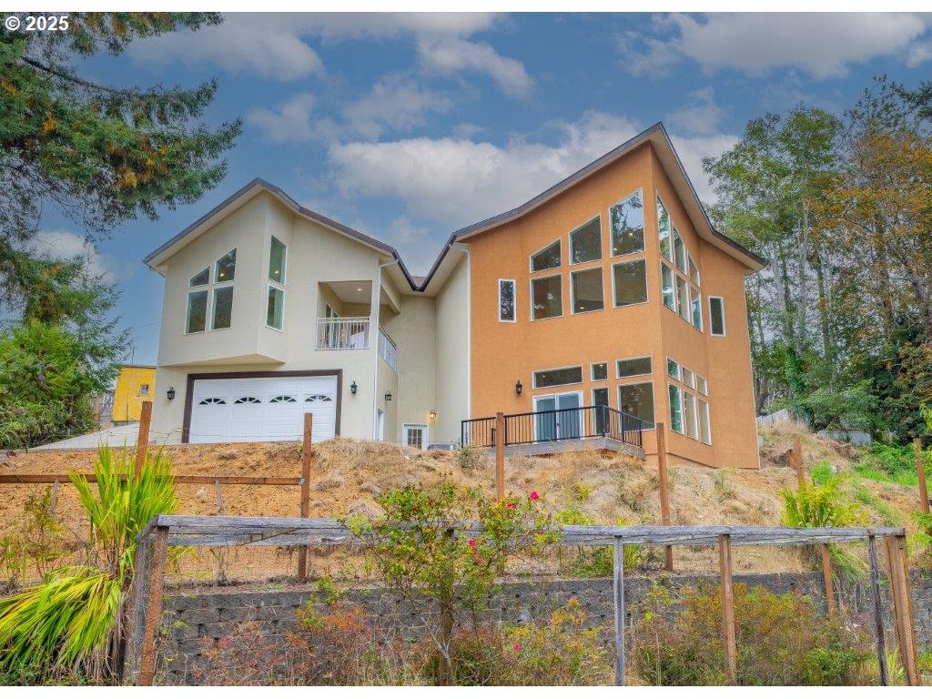 2495 Chester Street North Bend, OR 97459 - Photo 4 of 48 a front view of a house with a yard