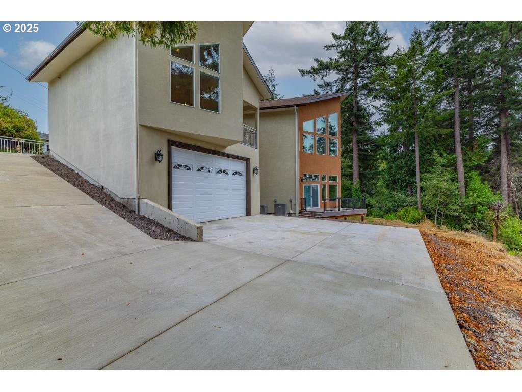 2495 Chester Street North Bend, OR 97459 - Photo 42 of 48 a view of a house with backyard and tree