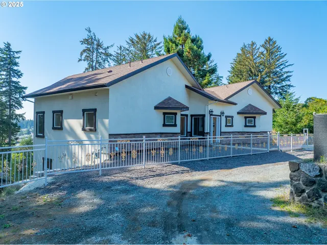 a view of house with yard and entertaining space