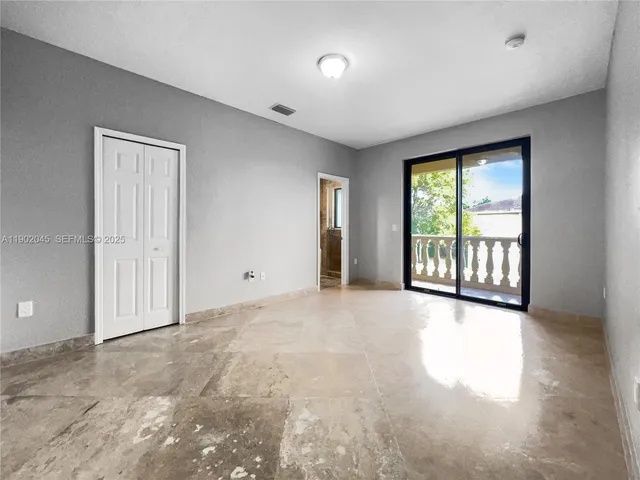 a spacious bathroom with double vanity and a shower