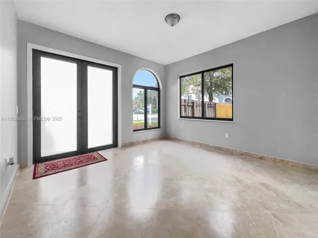 a kitchen with stainless steel appliances granite countertop a stove sink and cabinets