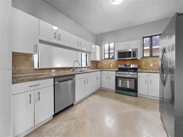 a bathroom with a sink toilet and vanity