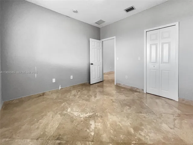 an empty room with an entryway