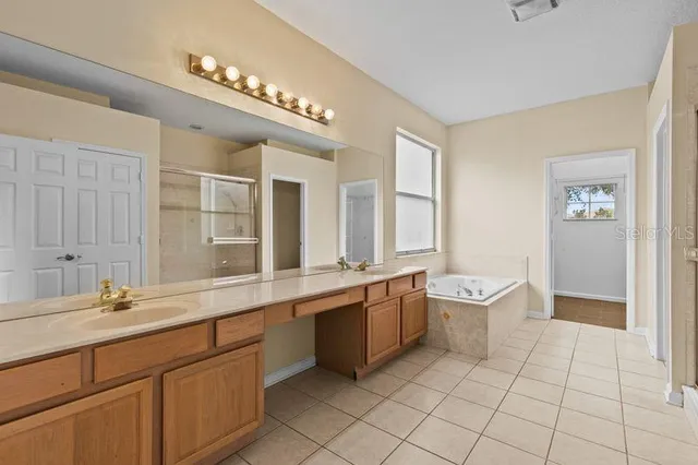 a bathroom with a sink double vanity and a mirror