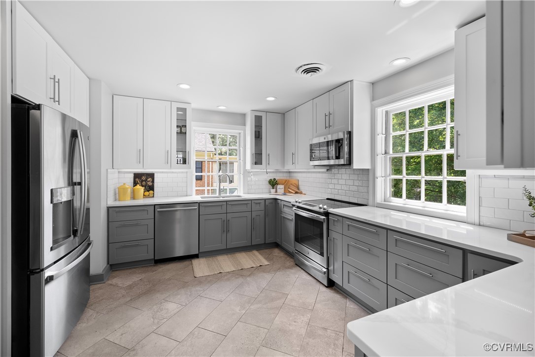 6161 River Road Richmond, VA 23226 - Photo 11 of 38 a kitchen with stainless steel appliances granite countertop a refrigerator sink and stove