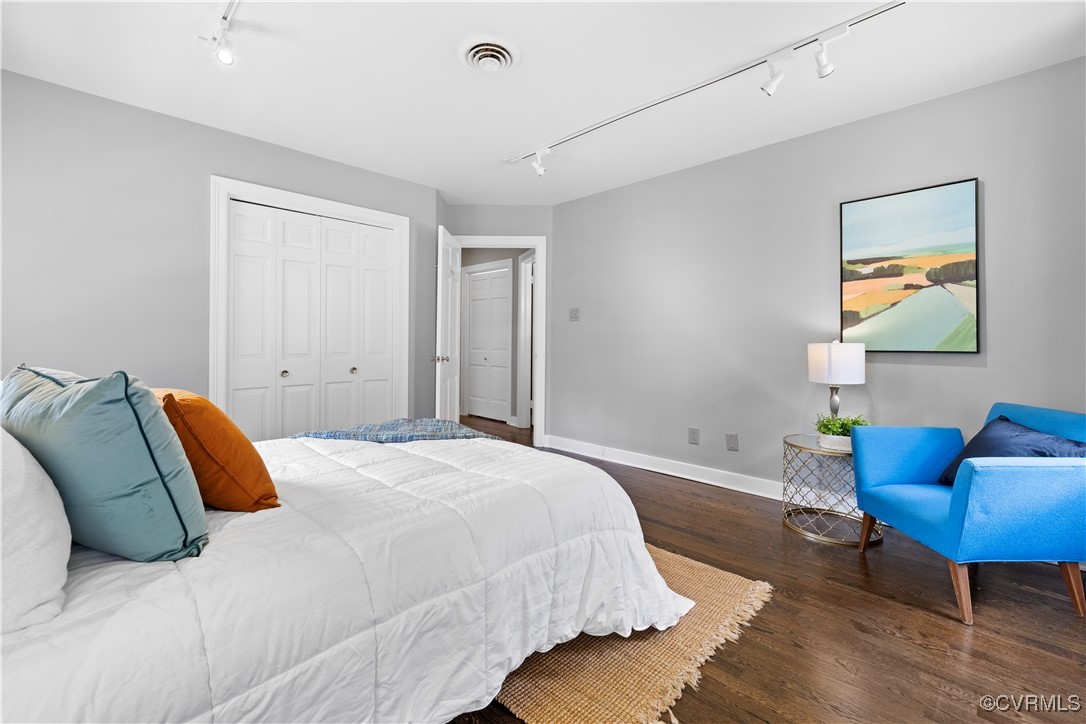 6161 River Road Richmond, VA 23226 - Photo 23 of 38 a bedroom with a bed and a chair