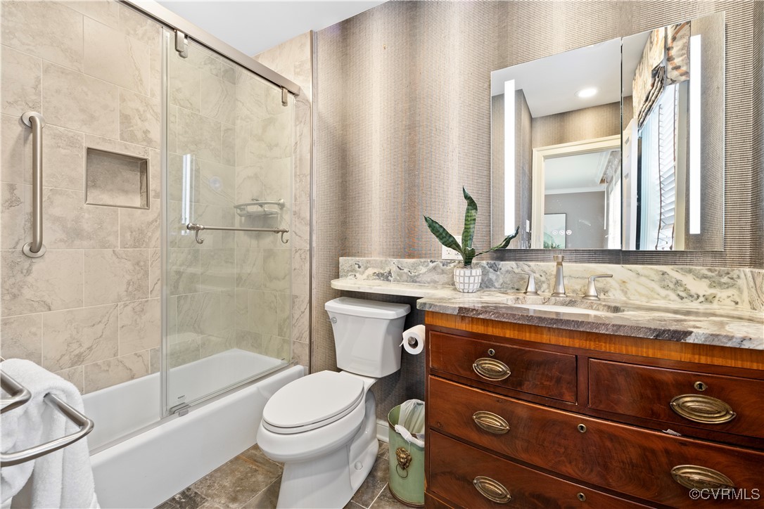 6161 River Road Richmond, VA 23226 - Photo 25 of 38 a bathroom with a granite countertop sink toilet and shower