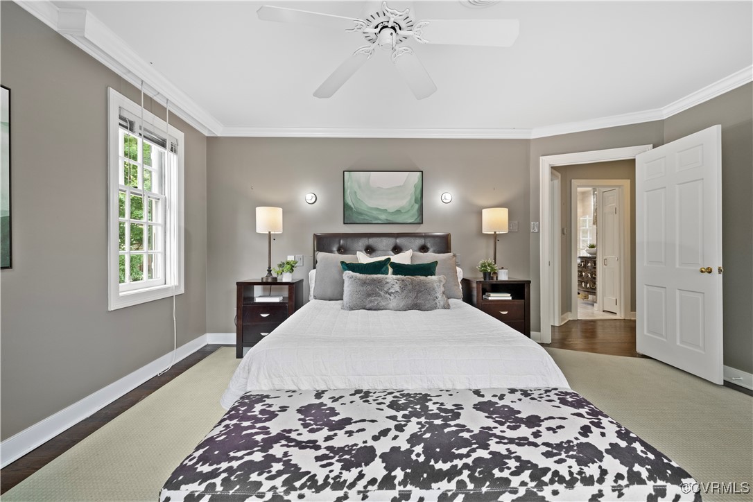 6161 River Road Richmond, VA 23226 - Photo 26 of 38 a large bedroom with a bed and wooden floor