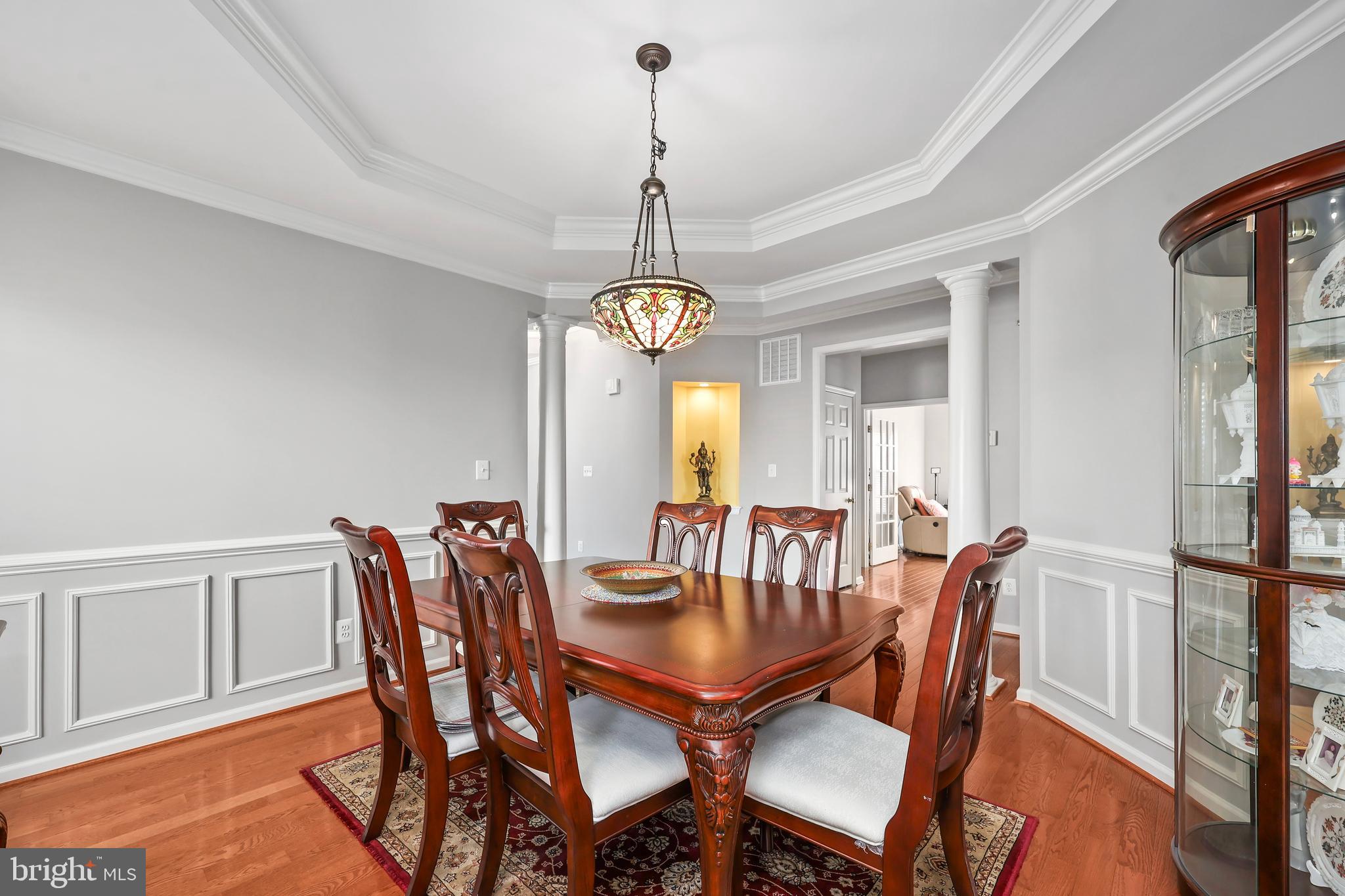 41742 Experience Way Aldie, VA 20105 - Photo 12 of 78 a view of a dining room with furniture window and wooden floor
