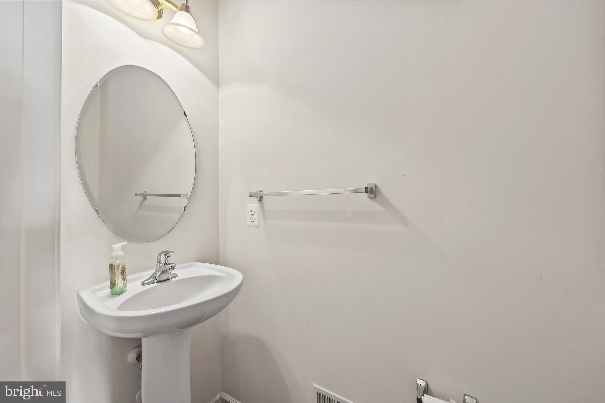 41742 Experience Way Aldie, VA 20105 - Photo 23 of 78 a bathroom with a sink and a mirror