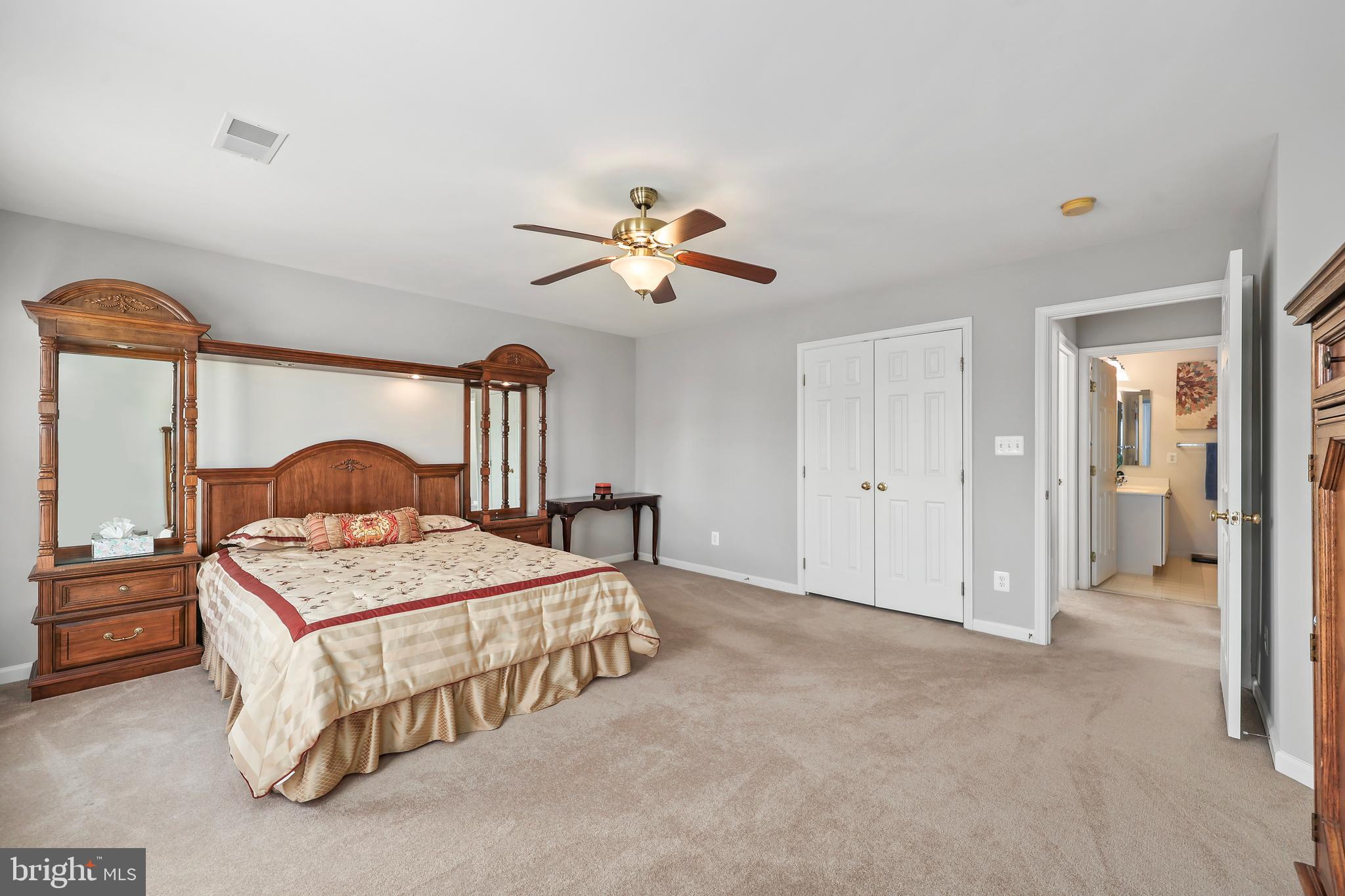 41742 Experience Way Aldie, VA 20105 - Photo 29 of 78 a bedroom with a bed and a chandelier