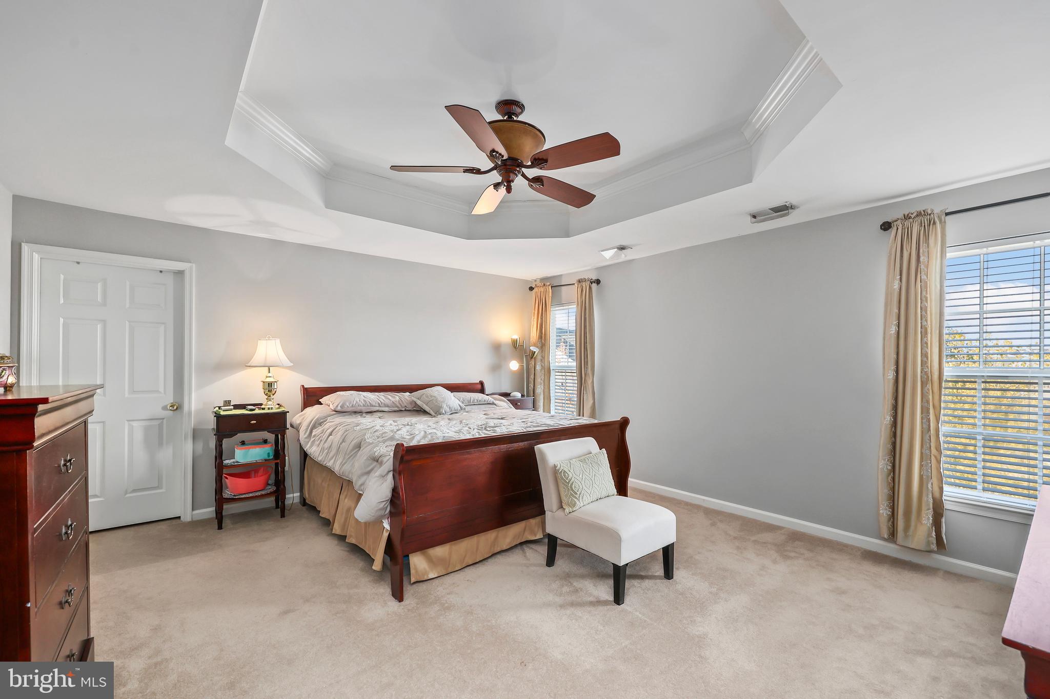 41742 Experience Way Aldie, VA 20105 - Photo 34 of 78 a bed room with a bed and a ceiling fan
