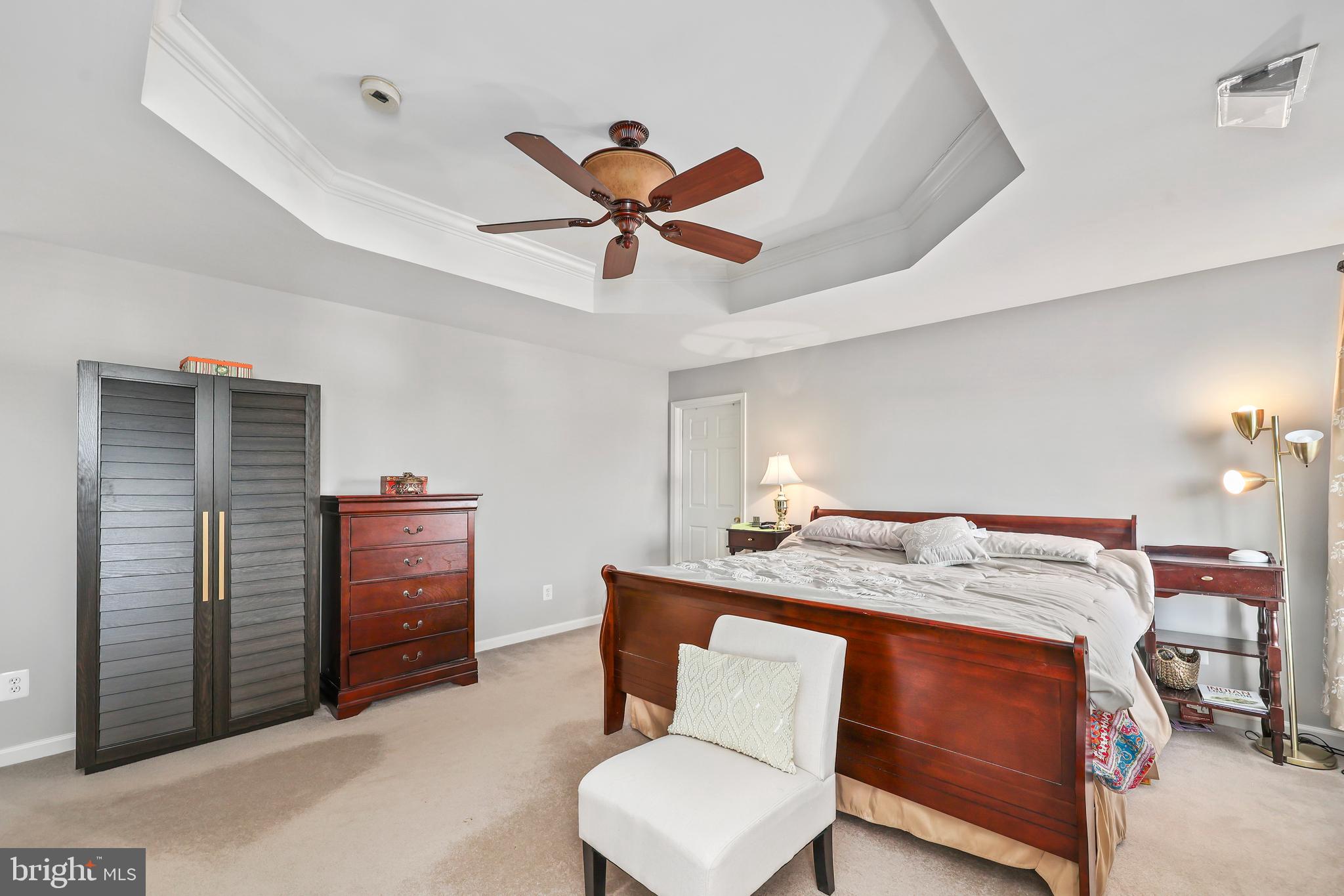 41742 Experience Way Aldie, VA 20105 - Photo 35 of 78 a bed room with a bed and a ceiling fan