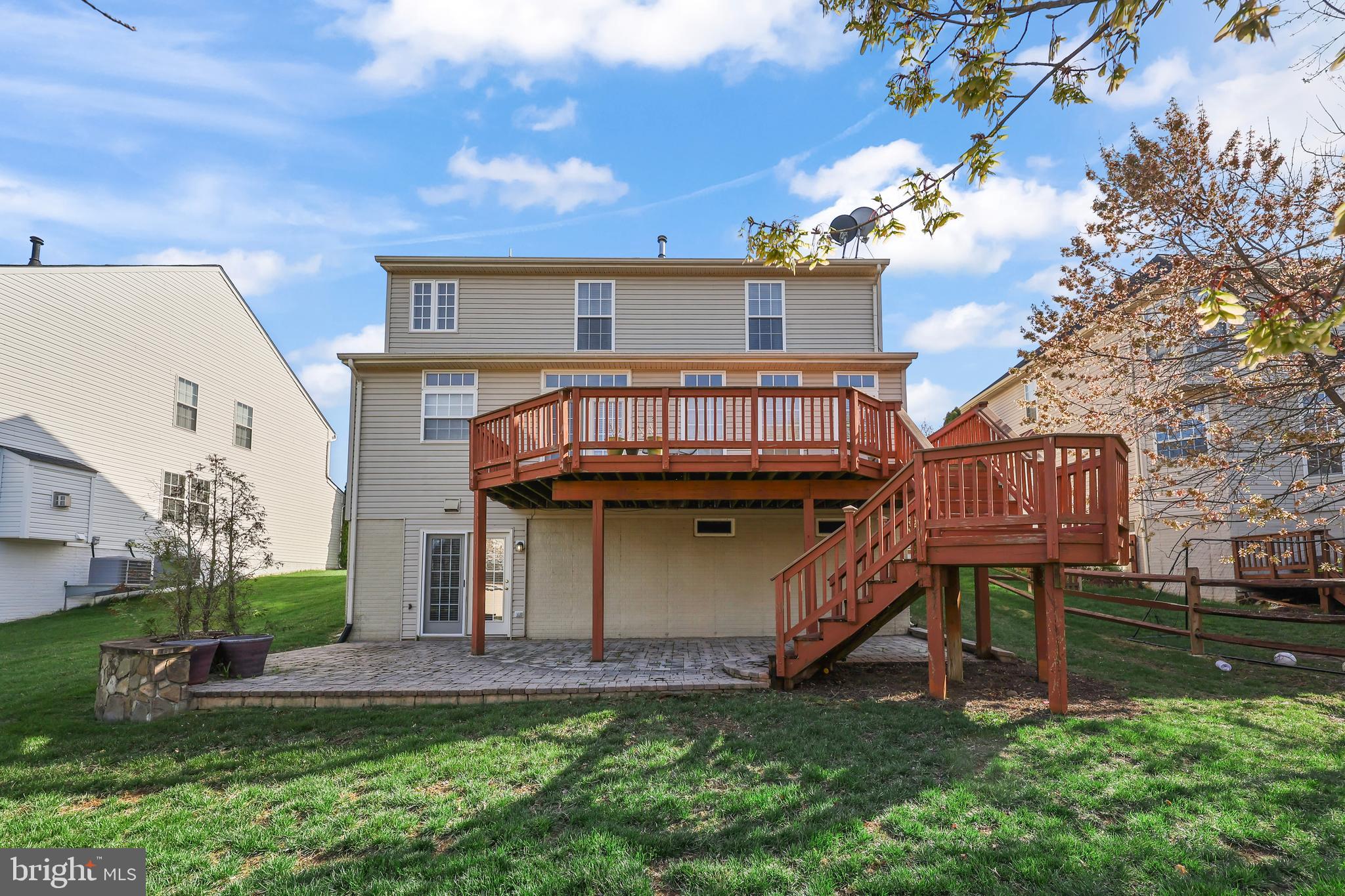 41742 Experience Way Aldie, VA 20105 - Photo 46 of 78 a view of a house with a yard and a deck