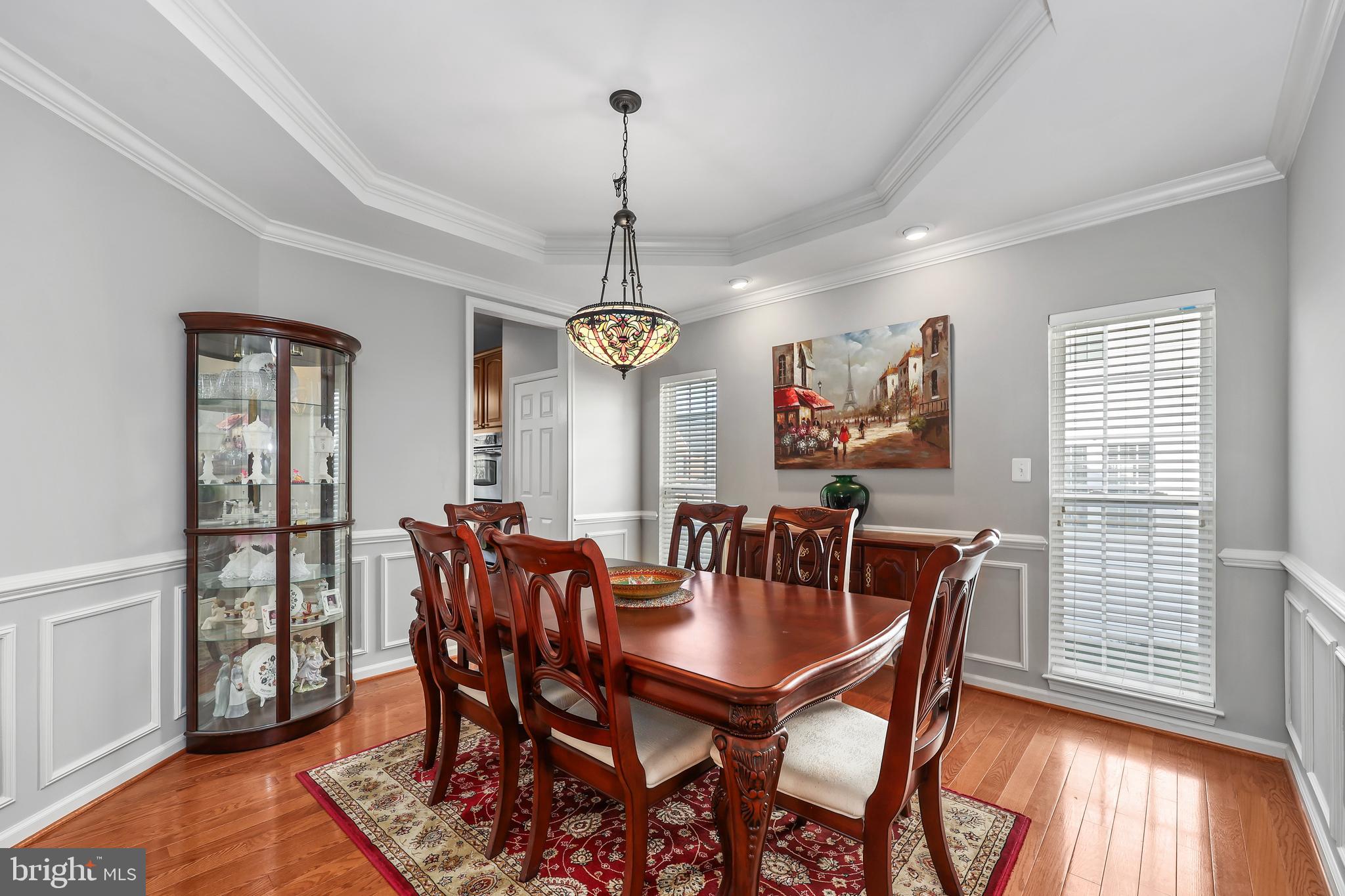 41742 Experience Way Aldie, VA 20105 - Photo 10 of 78 a view of a dining room with furniture window and wooden floor