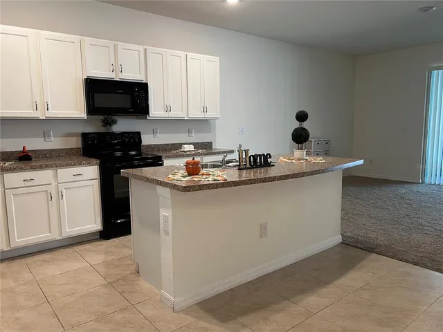 a view of a chandelier in big room