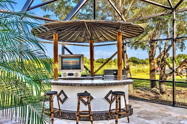 a view of entryway with a table and chairs