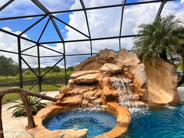 a aerial view of a house with a garden and balcony