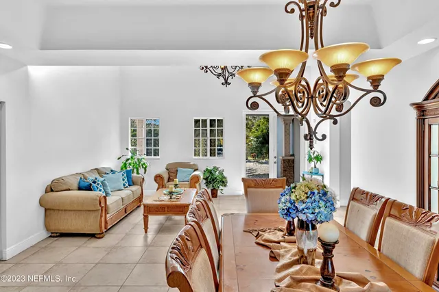 a dining room with furniture and window