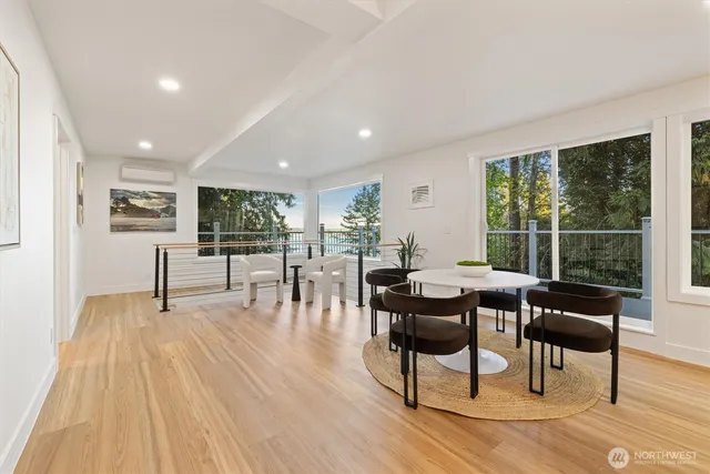 a dining room with furniture and wooden floor