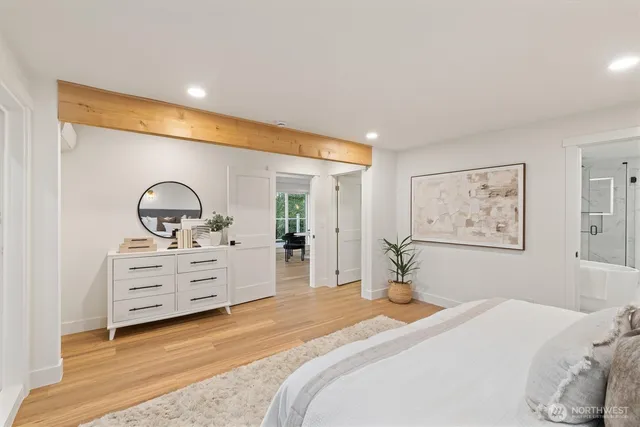 a bedroom with a bed and a dresser