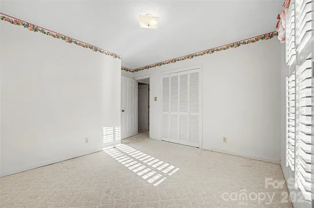 a bathroom with a double vanity sink mirror and shower
