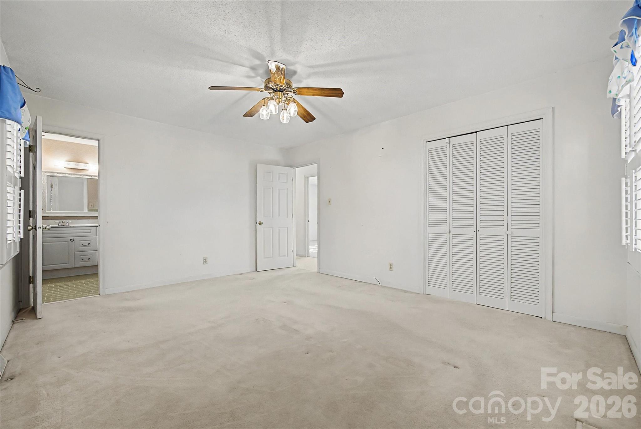 164 Foxcroft Road Rock Hill, SC 29732 - Photo 20 of 35 an empty room with closet and a chandelier fan