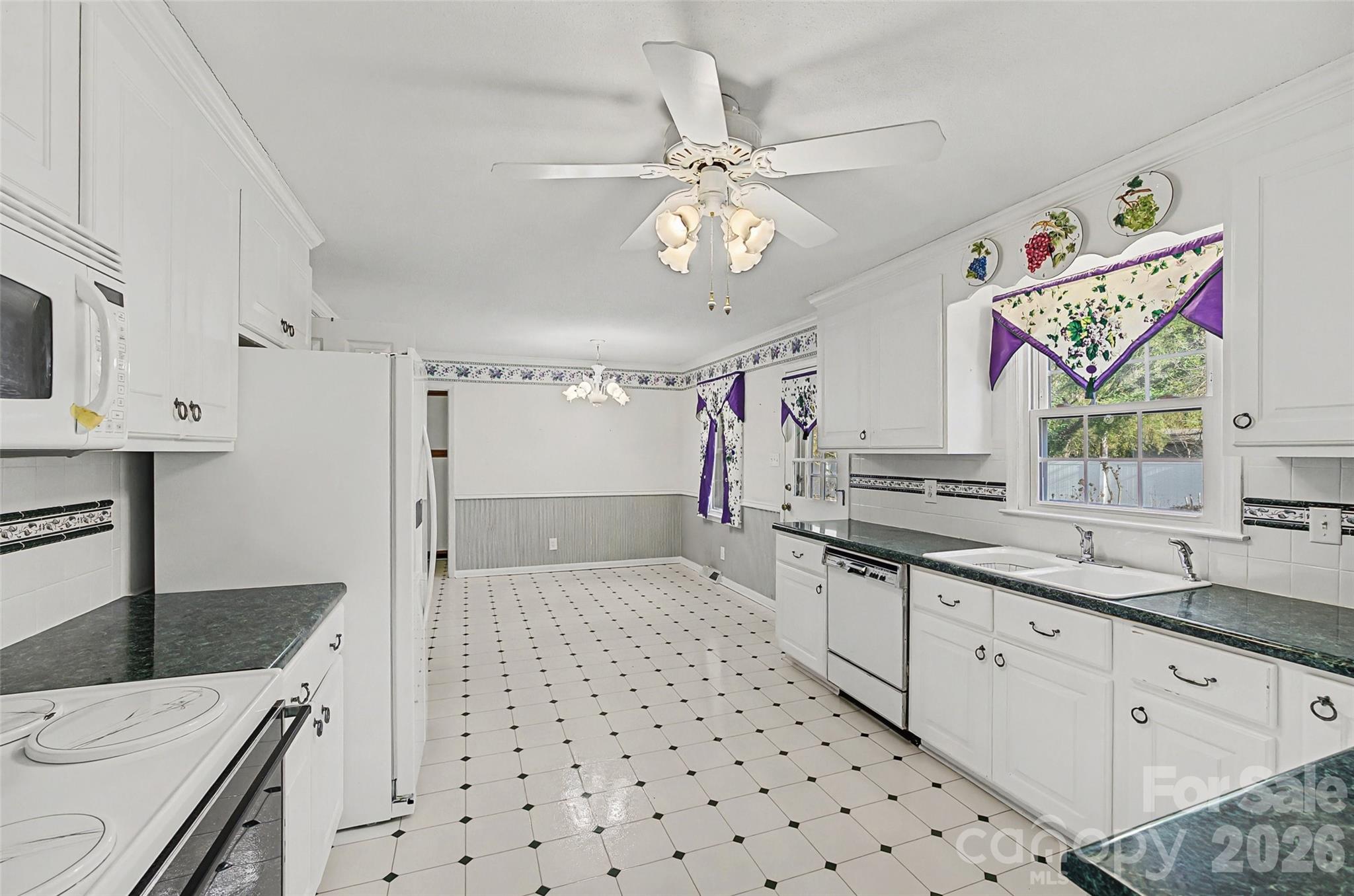 164 Foxcroft Road Rock Hill, SC 29732 - Photo 7 of 35 a kitchen with stainless steel appliances a sink a stove a refrigerator and white cabinets