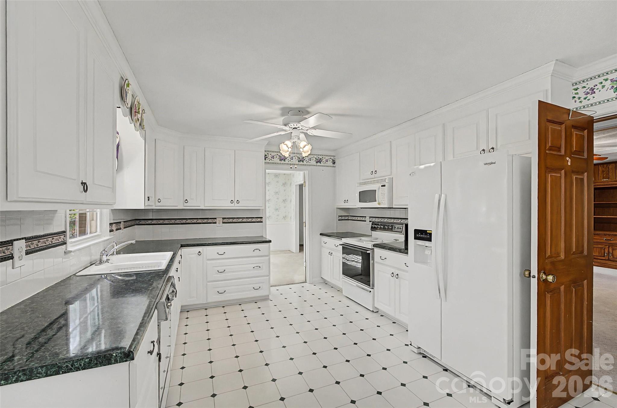 164 Foxcroft Road Rock Hill, SC 29732 - Photo 8 of 35 a kitchen with a sink stove and refrigerator