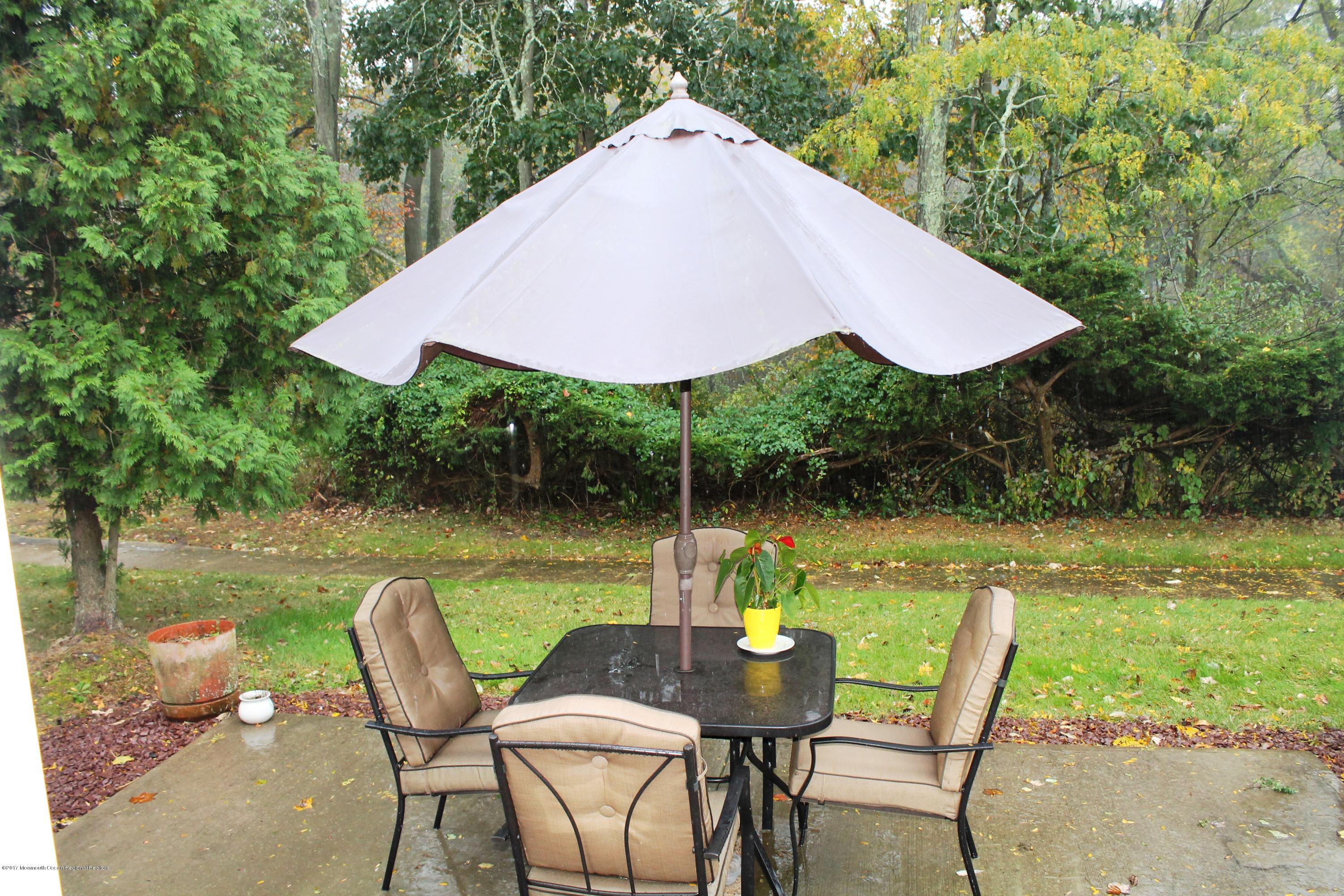 100 B Evesham Road, Unit 1000 Freehold, NJ 07728 - Photo 4 of 13 Private Patio Back to Woods