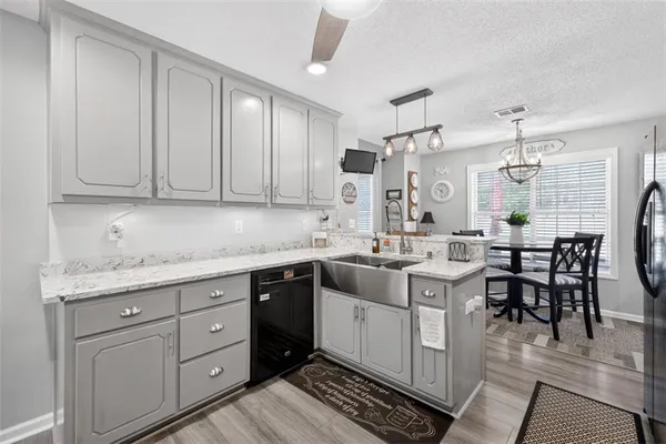 a kitchen with a sink and cabinets