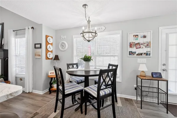 a dining room with furniture and window