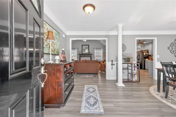 a bedroom with furniture and wooden floor