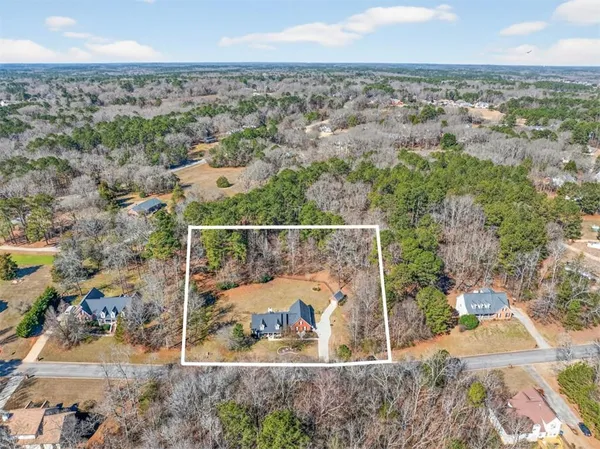 an aerial view of house with yard